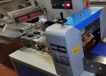 Горизонтальная упаковочная машина Hualian DXDZ- 450B